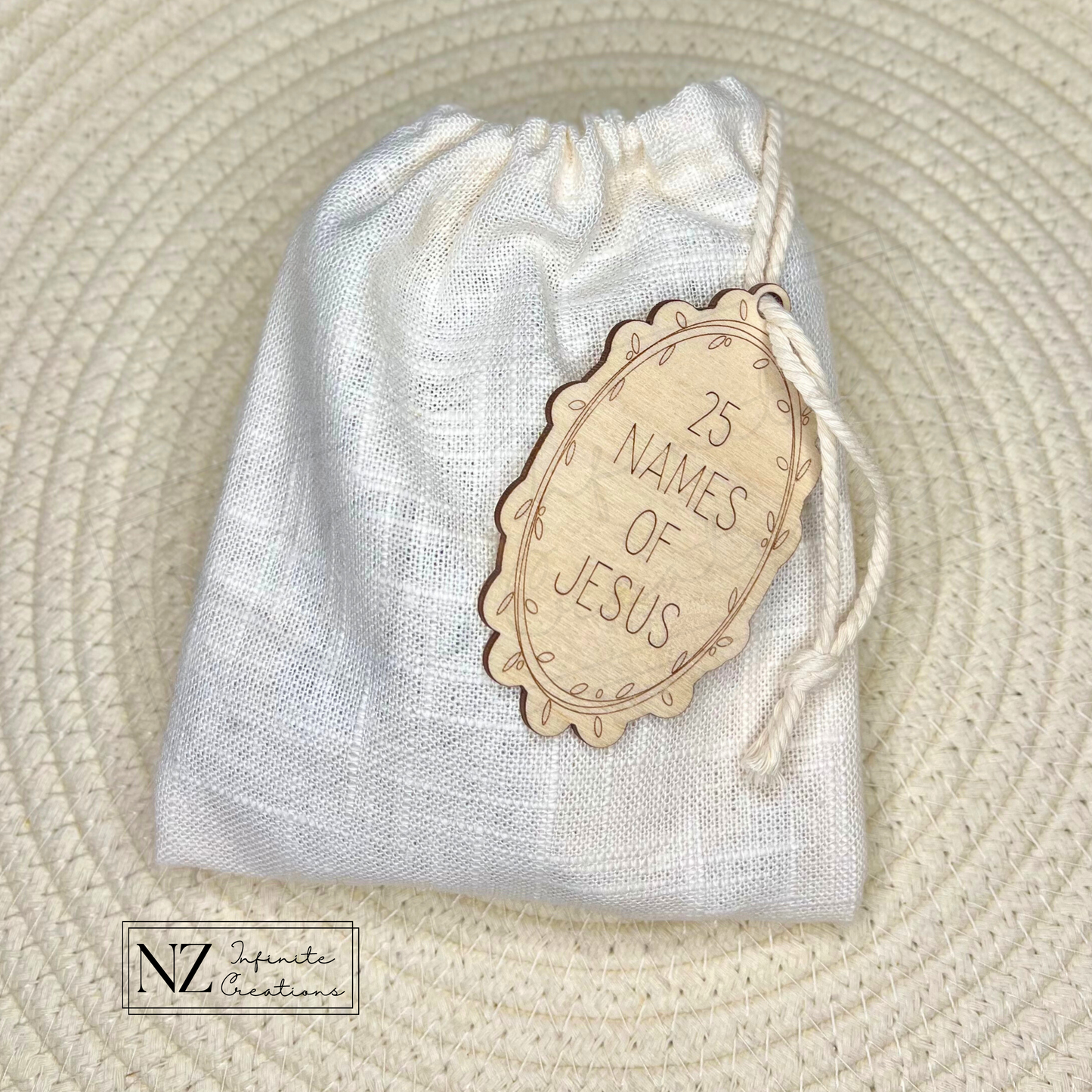 25 Names of Jesus Ornament Set made from natural wood with laser-engraved designs. Includes twine hangers and the option to purchase a handmade linen bag for storage. A faith-inspired addition to Christmas decor or a meaningful gift.