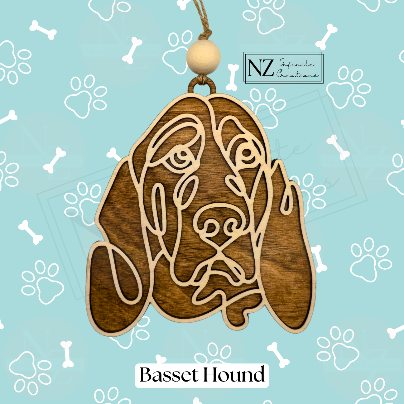 Basset Hound Line Art Ornament made from wood with a laser-engraved design. Includes twine and a wooden bead for hanging. A charming addition to holiday decor and a thoughtful gift for Basset Hound enthusiasts.