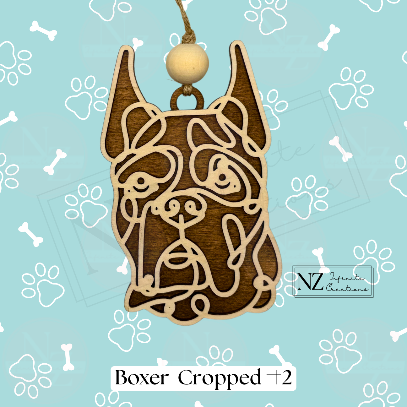 Boxer Dog Line Art Ornament crafted from wood with a sleek laser-engraved design. Includes twine and a wooden bead for hanging. A perfect gift for Boxer dog lovers and a delightful addition to your holiday decor.