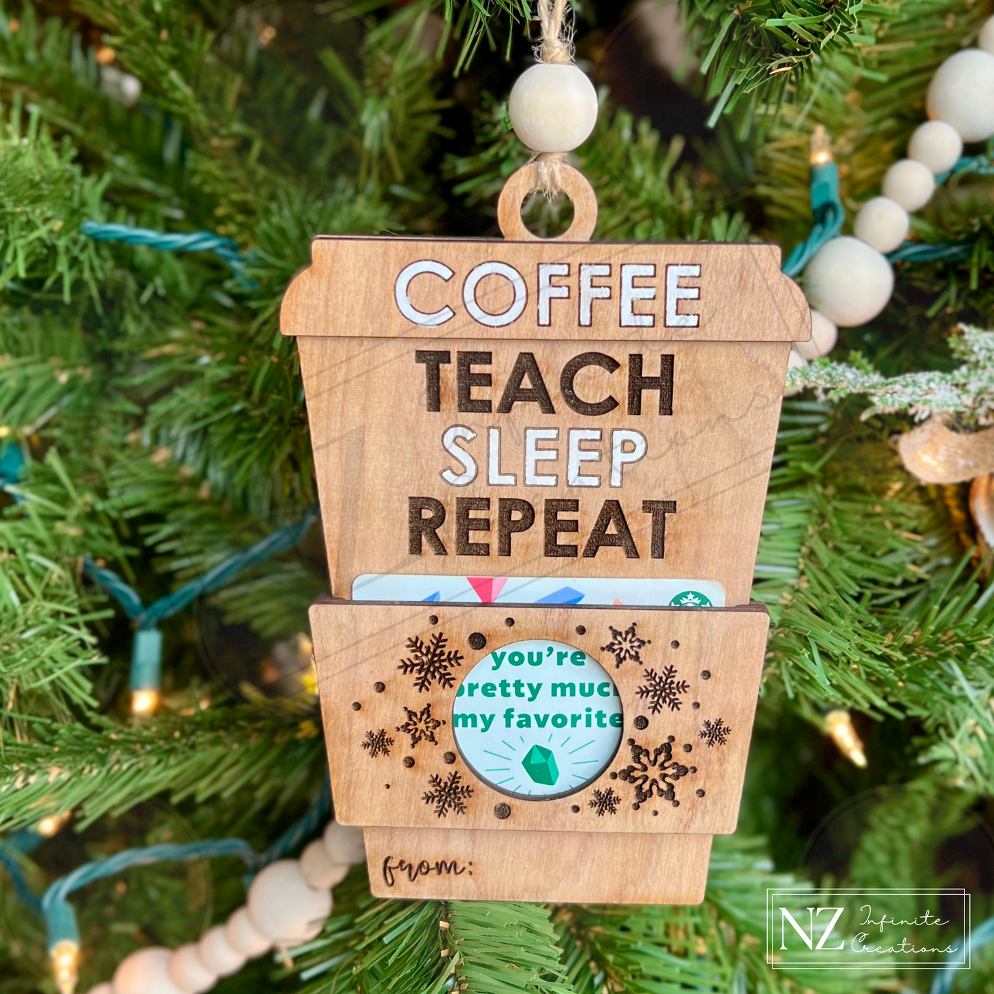 Coffee Teach Sleep Repeat Coffee Cup Gift Card Holder Ornament, crafted from wood with a fun engraved design. Perfect for teachers, this ornament doubles as a gift card holder, making it a thoughtful and practical holiday or appreciation gift.