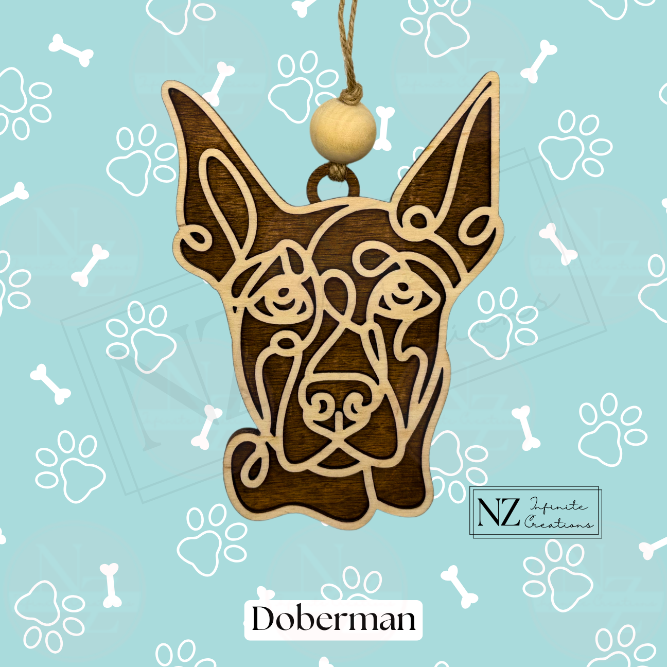 Doberman Line Art Ornament made from wood with a laser-engraved design. Includes twine and a wooden bead for easy hanging. A perfect gift for Doberman lovers and a striking addition to holiday decor or dog-themed collections.