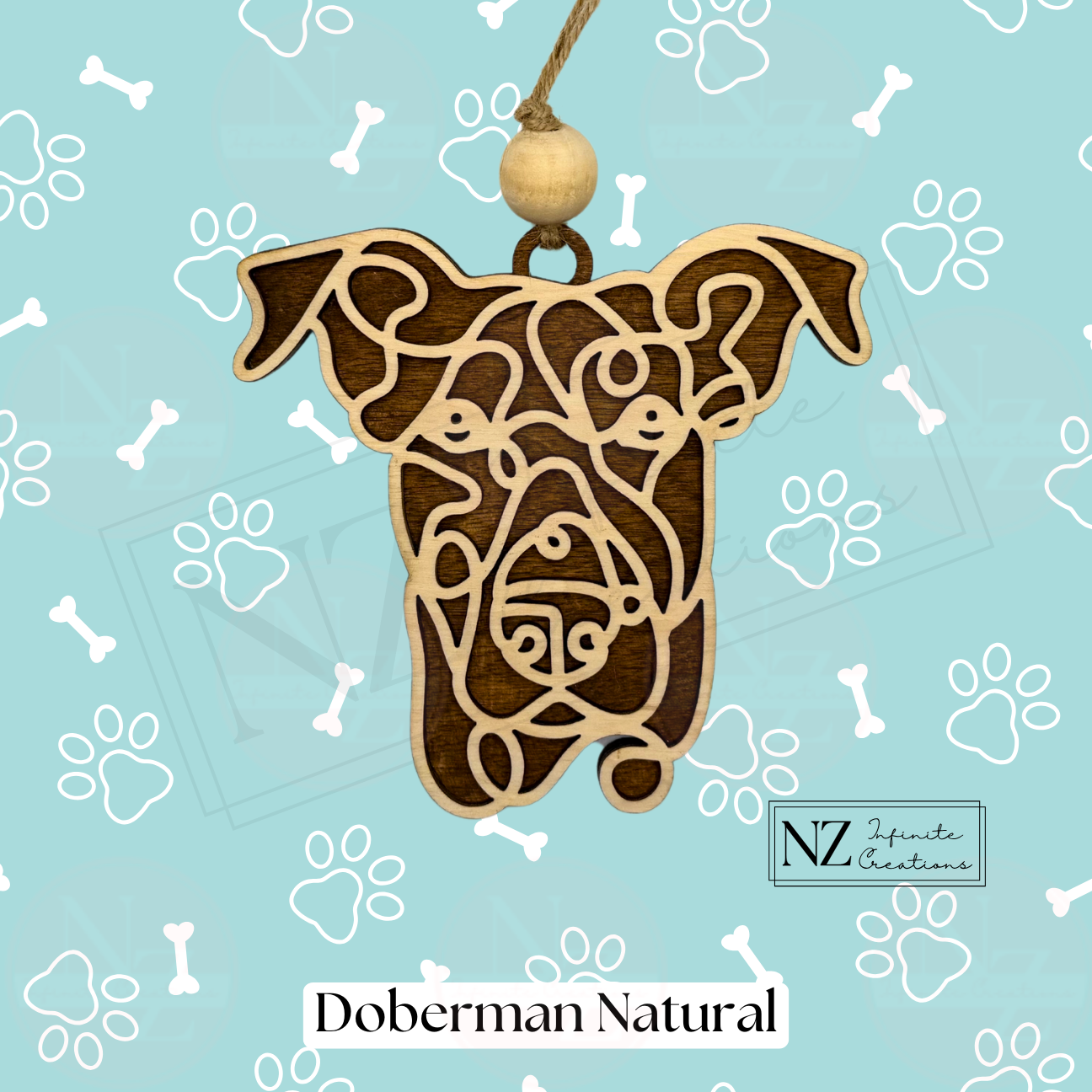 Doberman Line Art Ornament made from wood with a laser-engraved design. Includes twine and a wooden bead for easy hanging. A perfect gift for Doberman lovers and a striking addition to holiday decor or dog-themed collections.