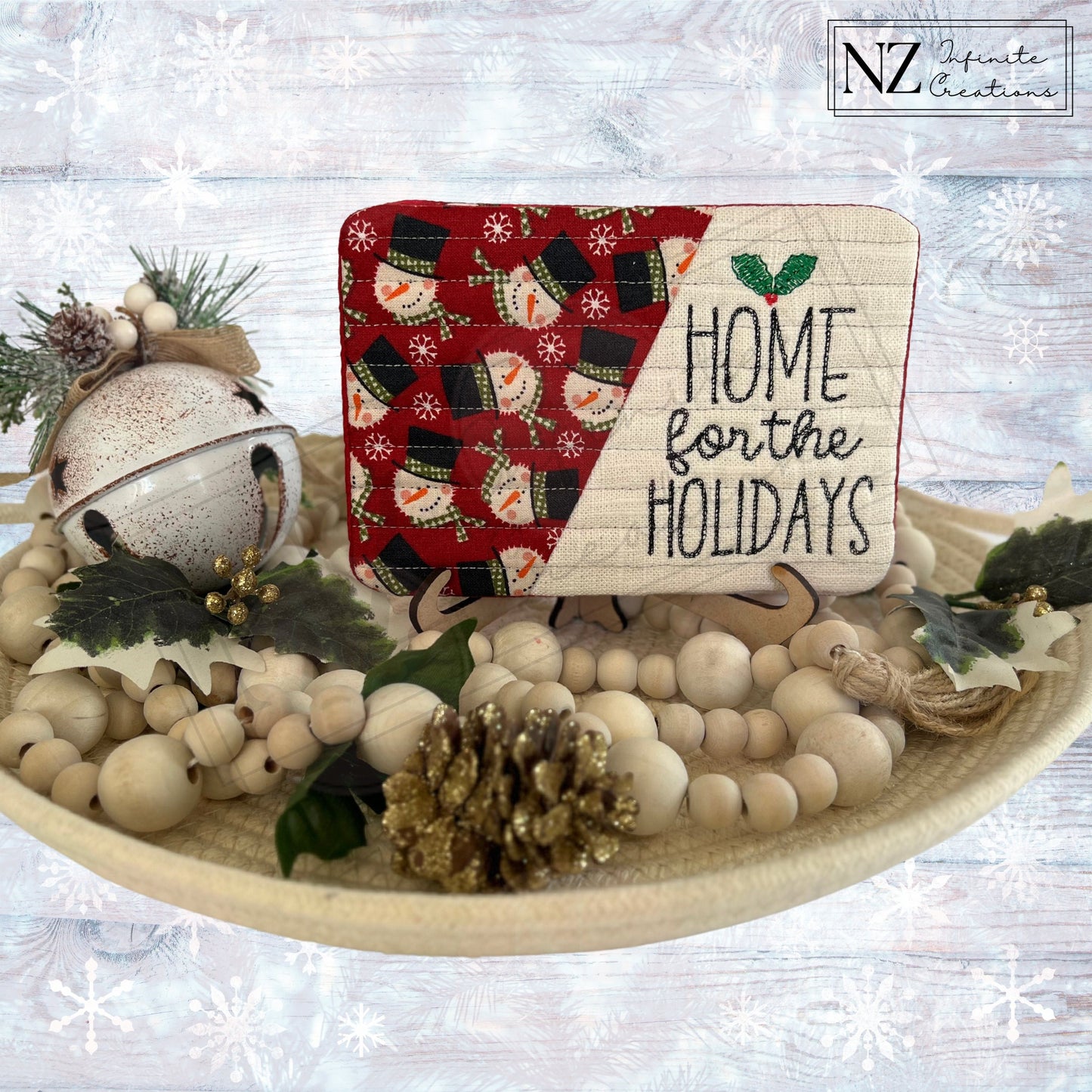 Embroidered Christmas Holiday Mug Rugs - 'Home for the Holidays' design. Made from fabric and batting, these festive mug rugs add a cozy touch to your holiday decor while protecting surfaces during the season.